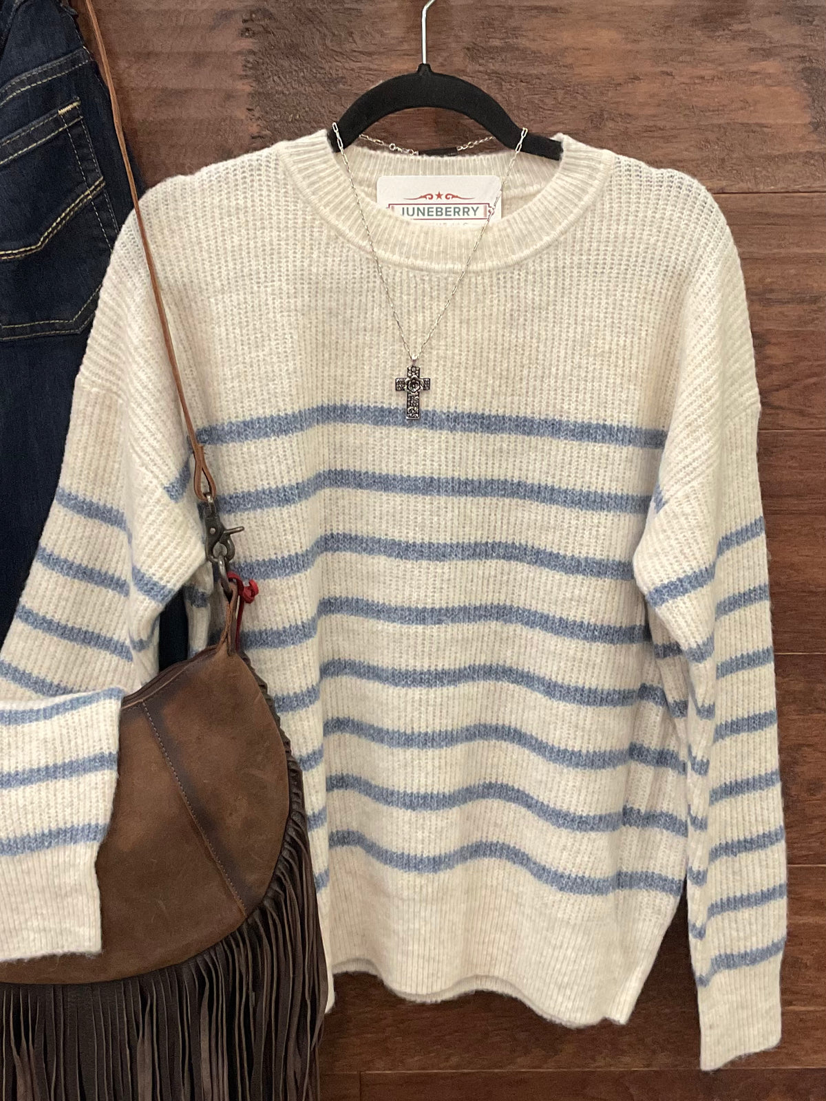 A cream and blue striped knit sweater 