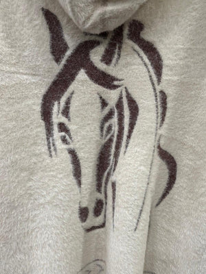 A cream-colored fuzzy knit hooded sweater with a brown horse graphic and geometric patterns. 