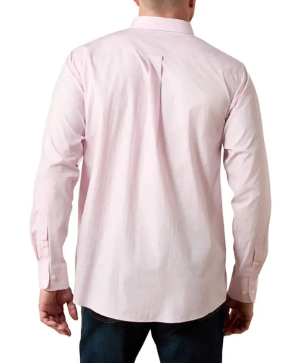 A man viewed from the back wearing a light pink long-sleeve button-up shirt and dark blue jeans against a plain white background.