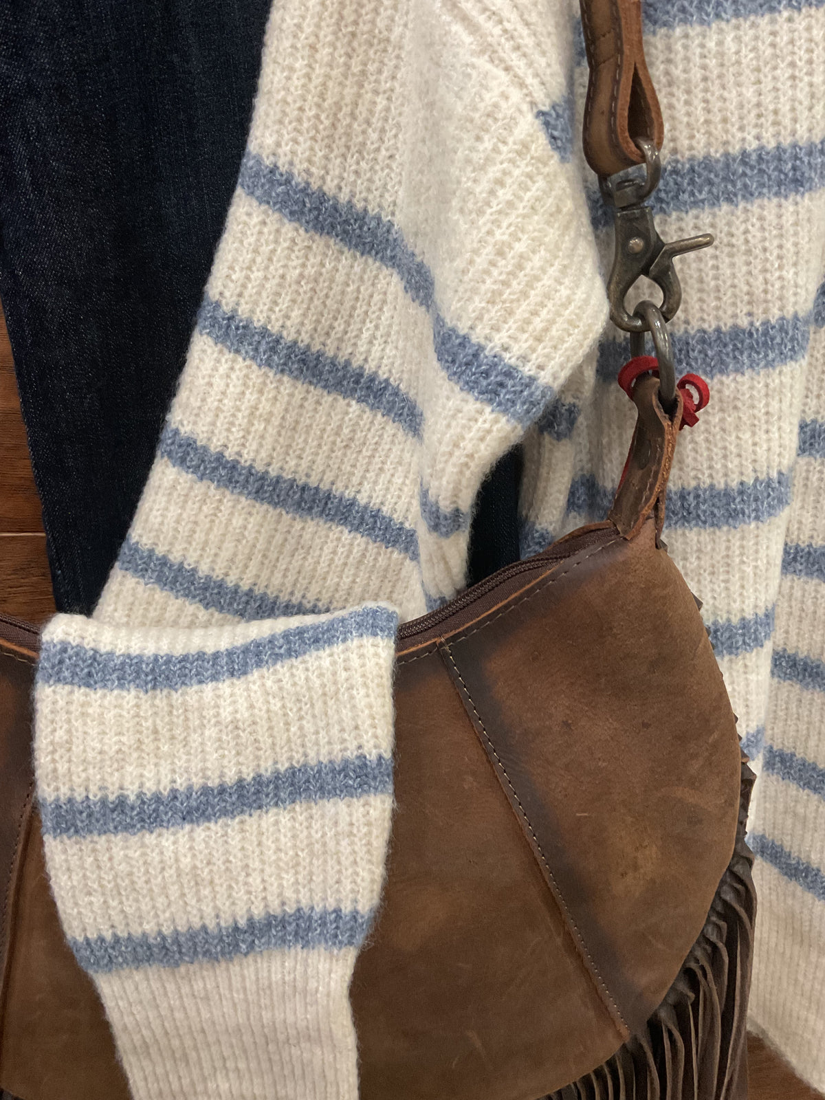 A cream and blue striped knit sweater 