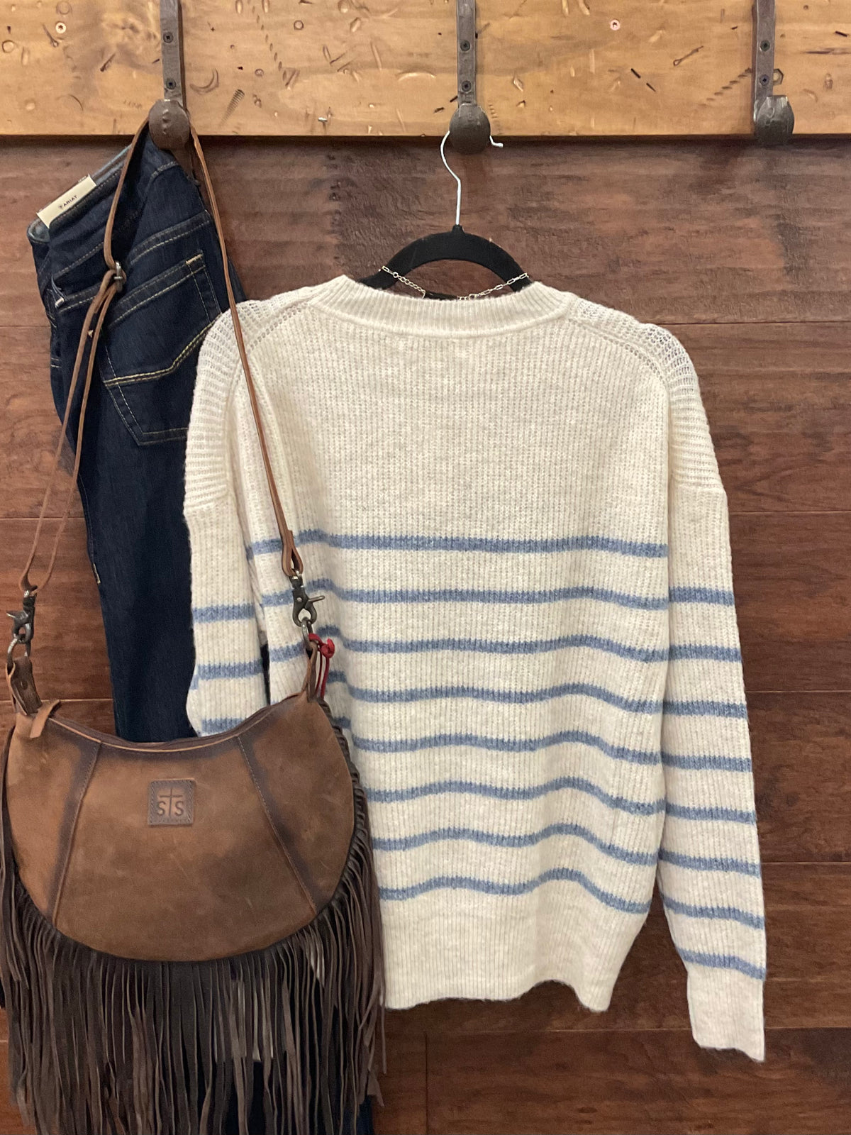 A cream and blue striped knit sweater 