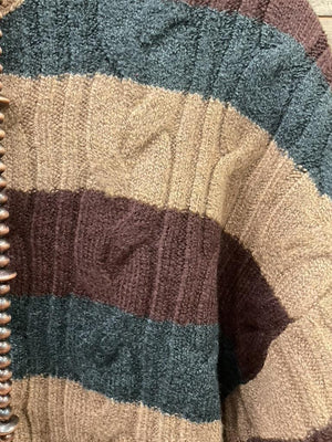 A striped cable-knit sweater in brown, beige, and charcoal. 
