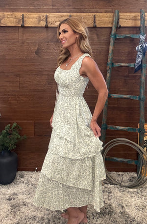  Ivory and olive dress features a vibrant, eye-catching floral print 