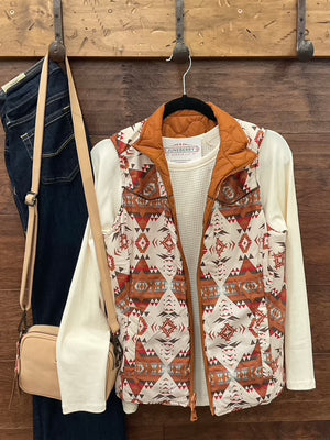  Reversible vest, featuring a striking Aztec print on one side and a solid camel finish on the reverse. 
