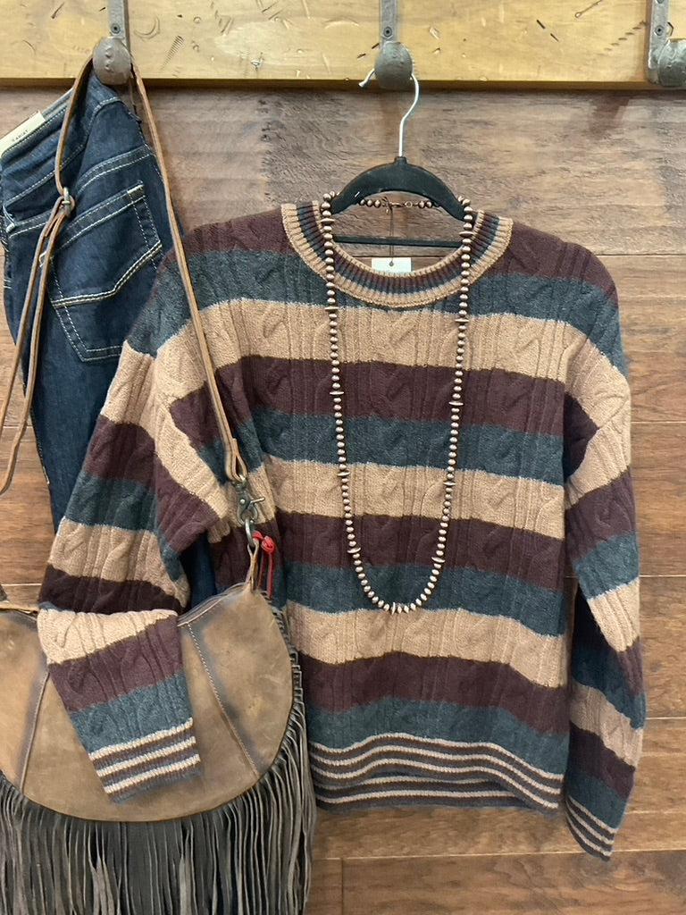 A striped cable-knit sweater 