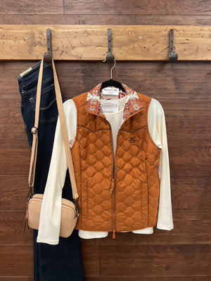  Reversible vest, featuring a striking Aztec print on one side and a solid camel finish on the reverse. 