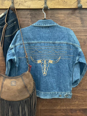 A blue denim jacket with a large embroidered steer skull design on the back. 