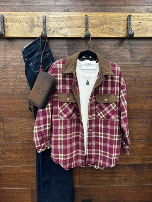 A burgundy and beige plaid flannel shirt with a brown corduroy collar and chest pockets