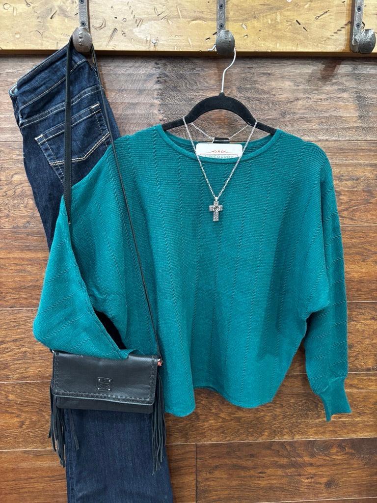This sweater features a refined vertical texture, long dolman sleeves, and a classic boat neckline 