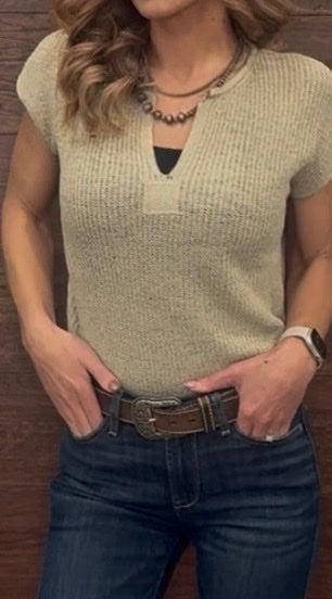 Woman wearing a Light Olive top 