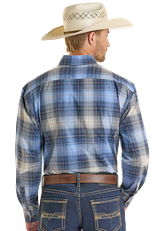Man wearing a blue plaid shirt and cowboy hat, standing against a neutral background