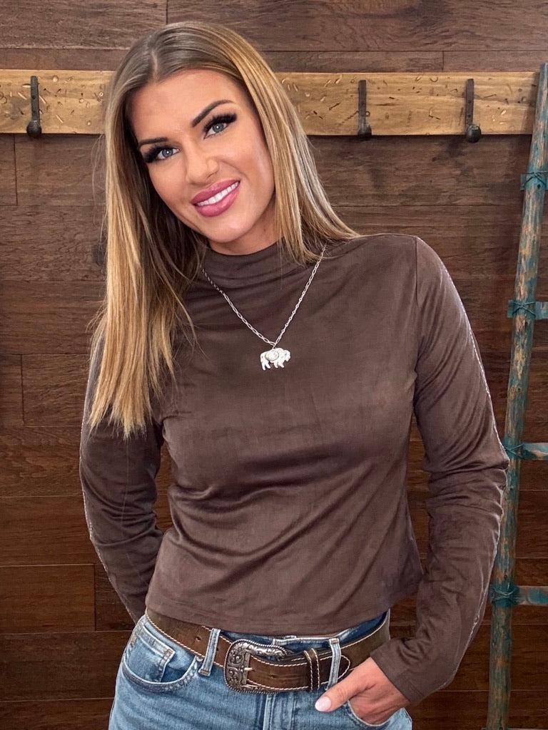  Brown long-sleeve mock neck top, blue jeans
