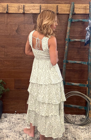  Ivory and olive dress features a vibrant, eye-catching floral print 