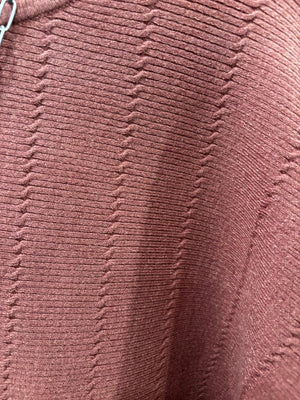 This sweater features a refined vertical texture, long dolman sleeves, and a classic boat neckline 