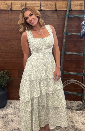  Ivory and olive dress features a vibrant, eye-catching floral print 