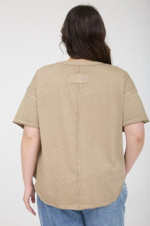 Woman wearing a beige t-shirt 