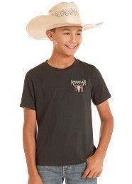 Child wearing a black t-shirt with a logo and a cowboy hat
