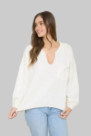 Woman wearing a Ivory sweater