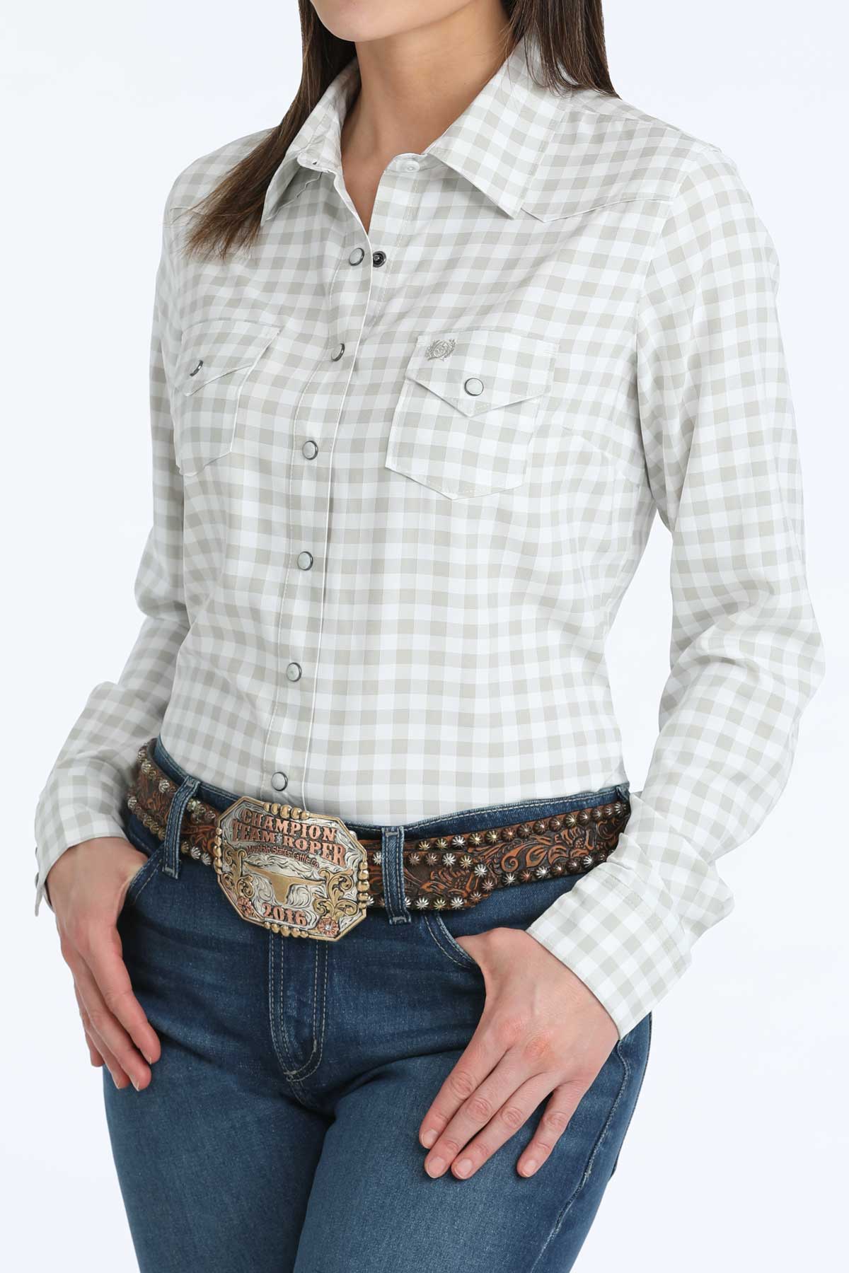 Person wearing a checkered shirt and jeans with a decorative belt on a white background