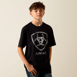 Child wearing a black Ariat t-shirt with a logo on a beige background