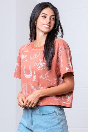 Woman wearing a patterned rust shirt