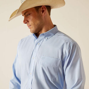Man wearing a light blue button-up shirt