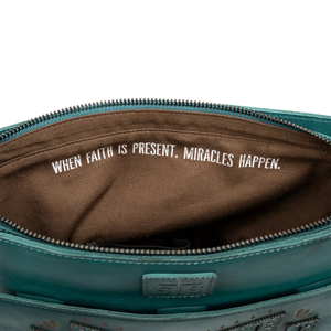 Teal bag with brown interior and motivational quote on a white background
