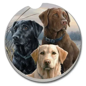 Car coaster with three Labrador Retriever dogs on a scenic background