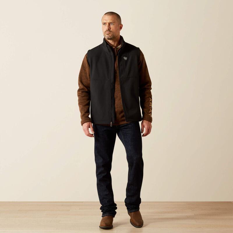 A man wearing a black zip-front vest. 