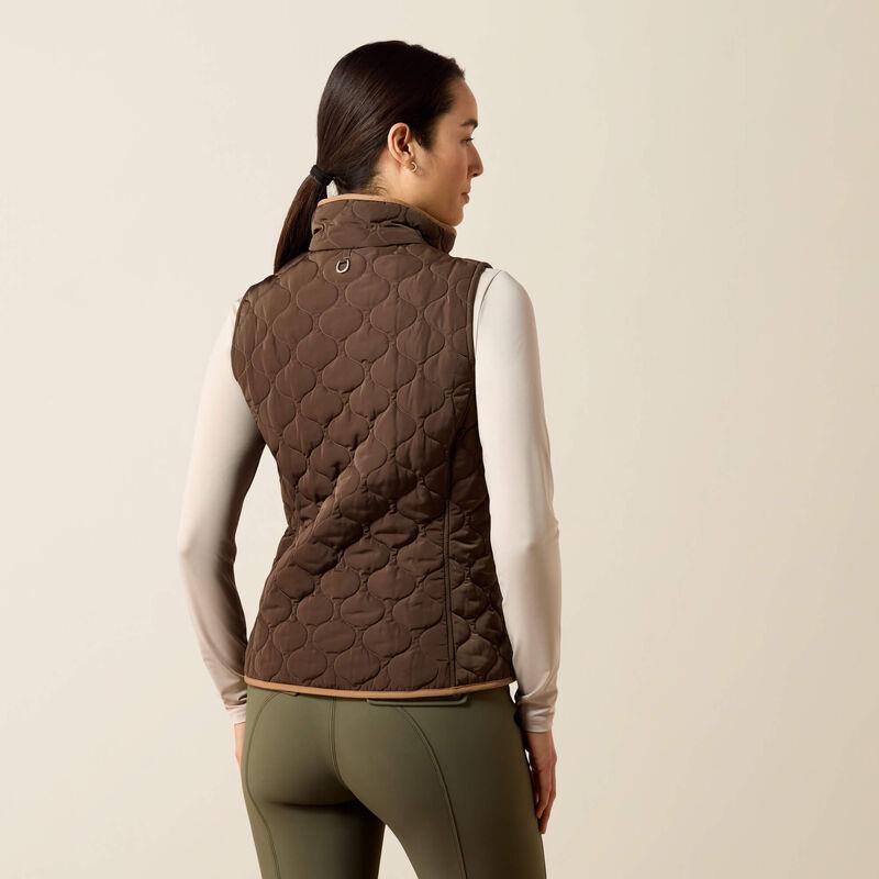A woman modeling a brown quilted zip-front vest 