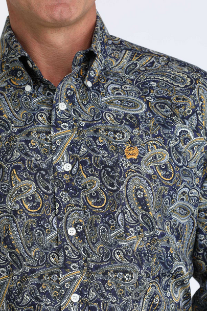 Close-up of a patterned shirt with a focus on the collar and buttons.