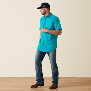 Man wearing a turquoise shirt 