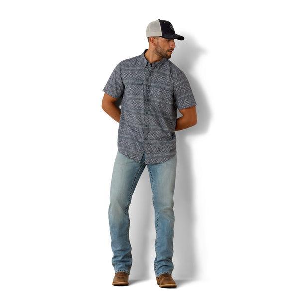 Man wearing a Navy patterned short-sleeve shirt 