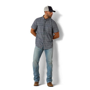 Man wearing a Navy patterned short-sleeve shirt 