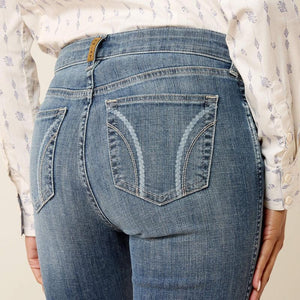 Close-up of blue jeans with a neutral background