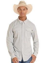 Man wearing a light gray long-sleeve shirt and cowboy hat outdoors