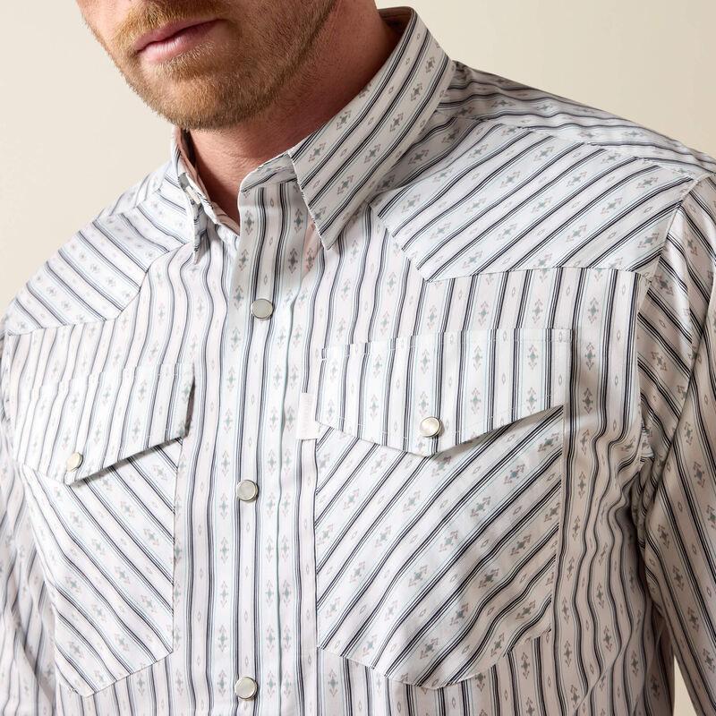 A man wearing a long-sleeve western-style button-down shirt with thin vertical blue and white stripes