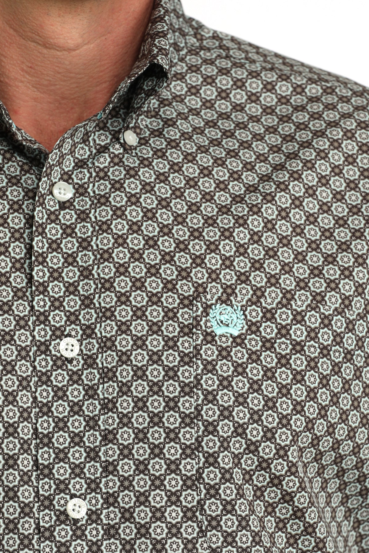 Close-up of a patterned shirt with a floral design on a white background