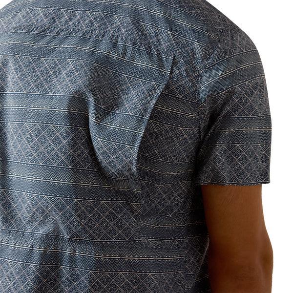 Man wearing a Navy patterned short-sleeve shirt 