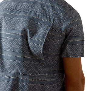 Man wearing a Navy patterned short-sleeve shirt 
