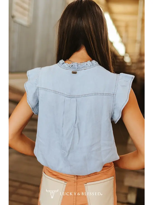 Light blue denim shirt with ruffled collar