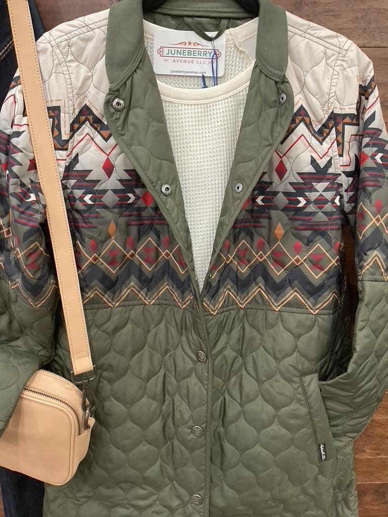 An olive green quilted jacket with a colorful geometric pattern across the chest and upper sleeves  