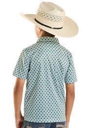 Child wearing a patterned shirt and cowboy hat