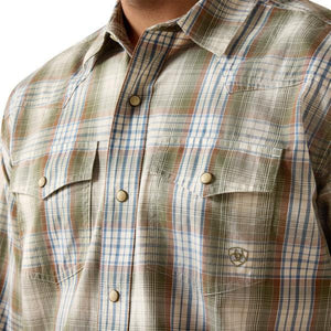 Man wearing a olive green plaid shirt 