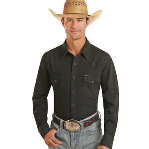 A man wearing a black western long-sleeve snap-down shirt 