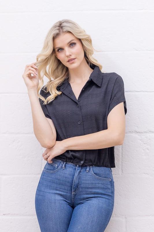 Woman wearing a black short-sleeve shirt