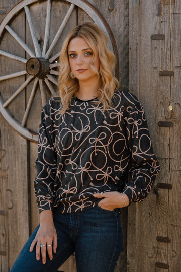 Women’s crew neck super soft shirt with western ropes on it. 