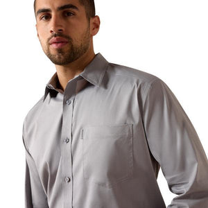 Man wearing a gray dress shirt 