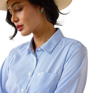 Woman wearing a blue striped shirt and beige hat on a white background
