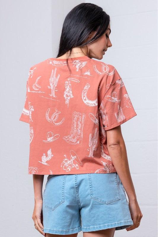 Woman wearing a patterned rust shirt